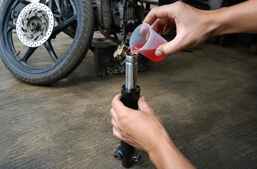 takaran oli shock depan supra x 125